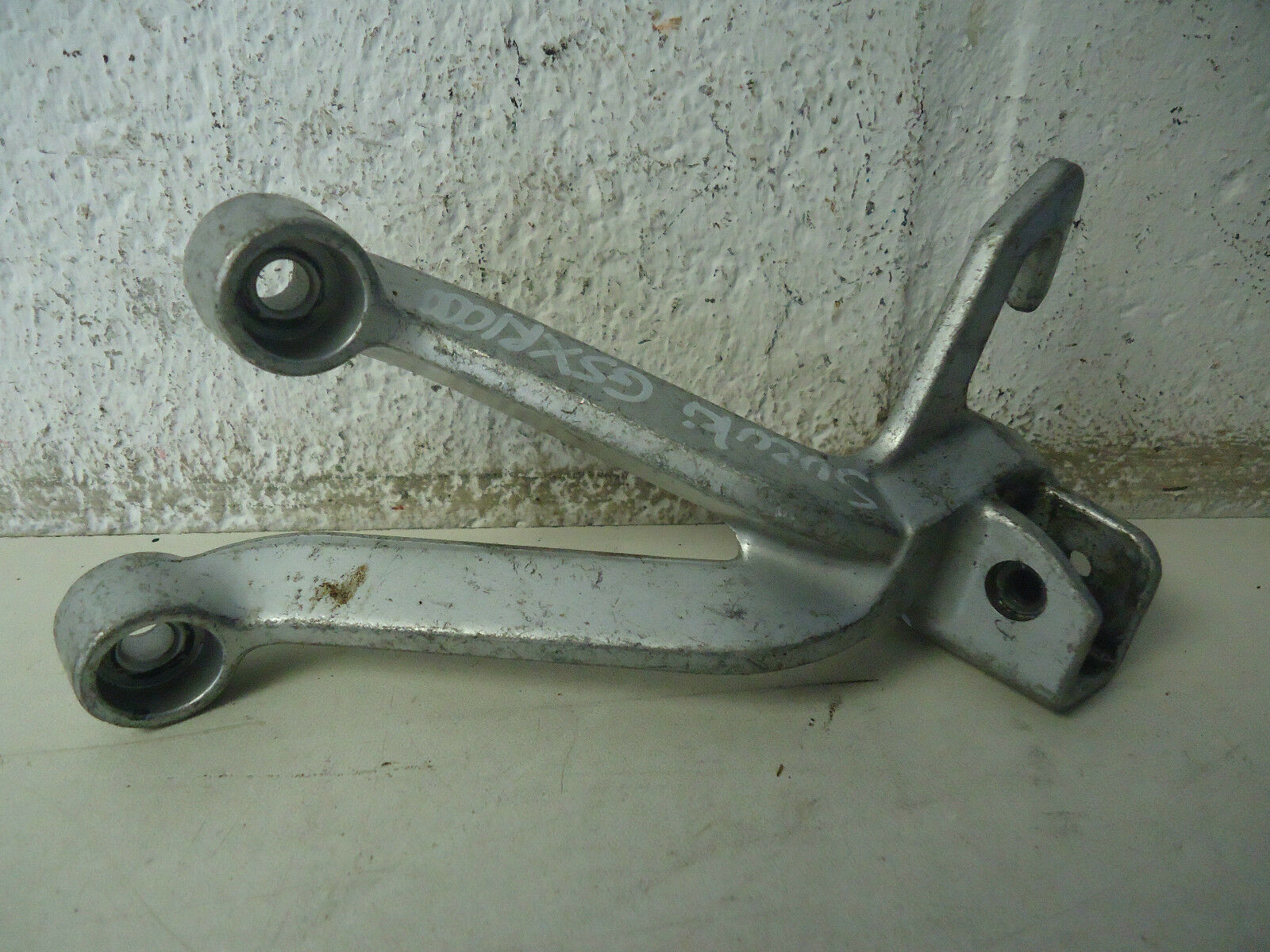 SUZUKI GSXR 1000 LH REAR FOOTREST HANGER 