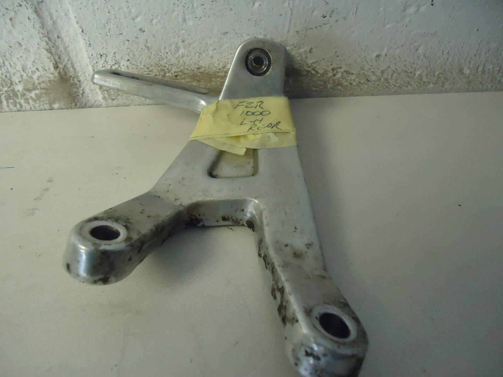 YAMAHA FZR1000 GENESIS LH REAR FOOTREST HANGER 1988