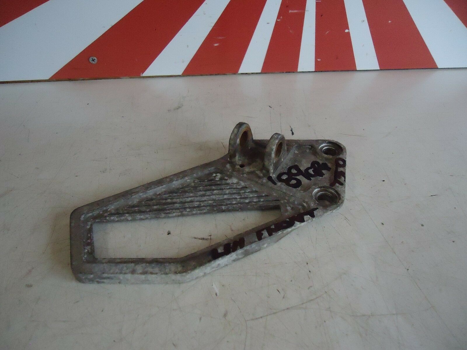 KAWASAKI GPX750R LH FRONT FOOTREST HANGER 1989 